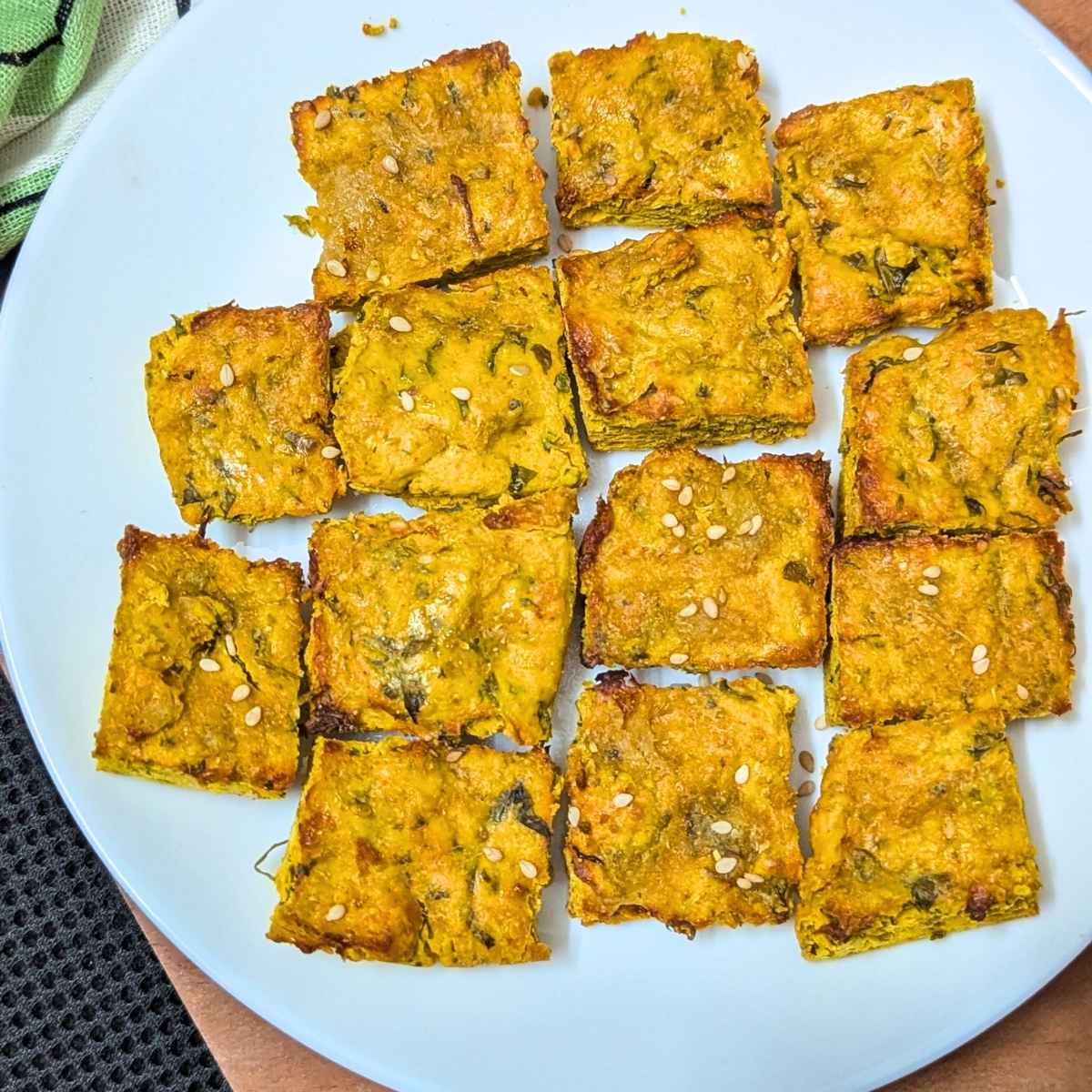 Kothimbir vadi served on a white plate.