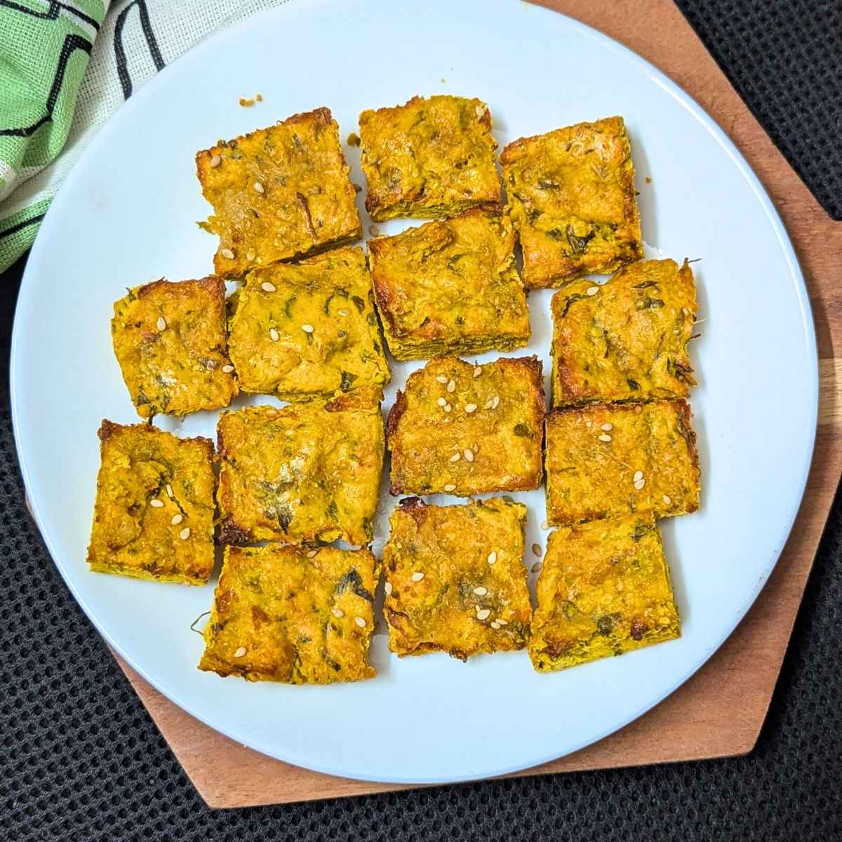 Kothimbir vadi served on a white plate.