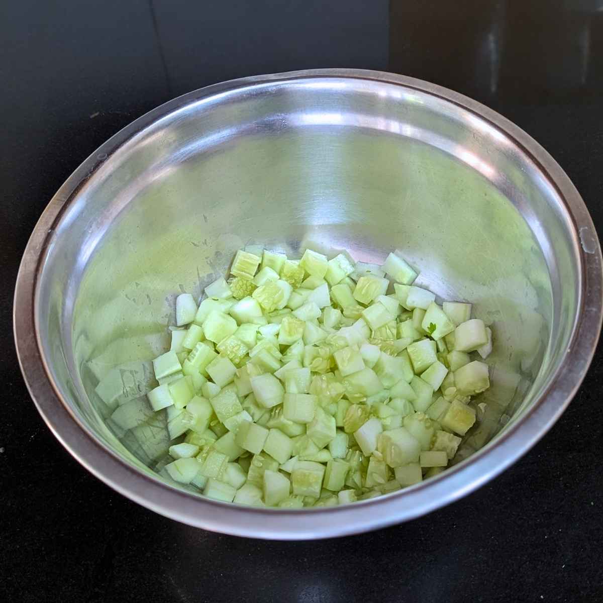 Cubed cucumbers in a shallow bowl