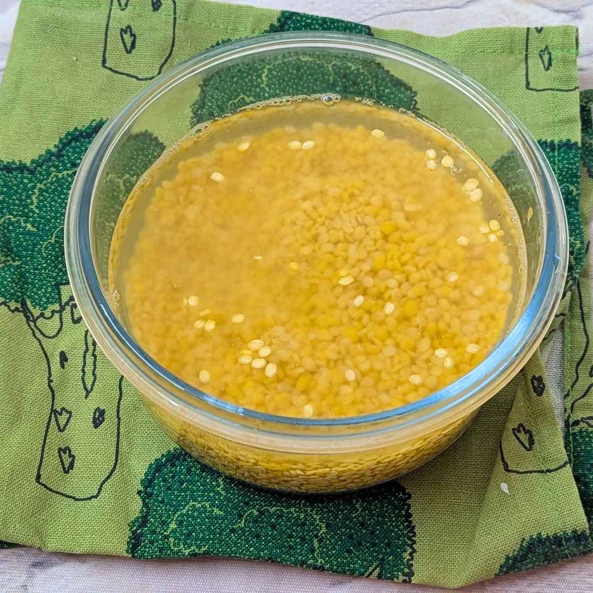 Moong dal soaked in water.