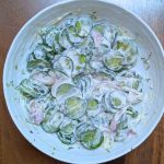 Creamy cucumber salad in a bowl