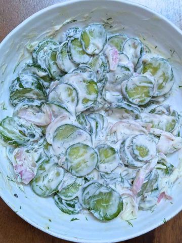 Creamy cucumber salad in a bowl