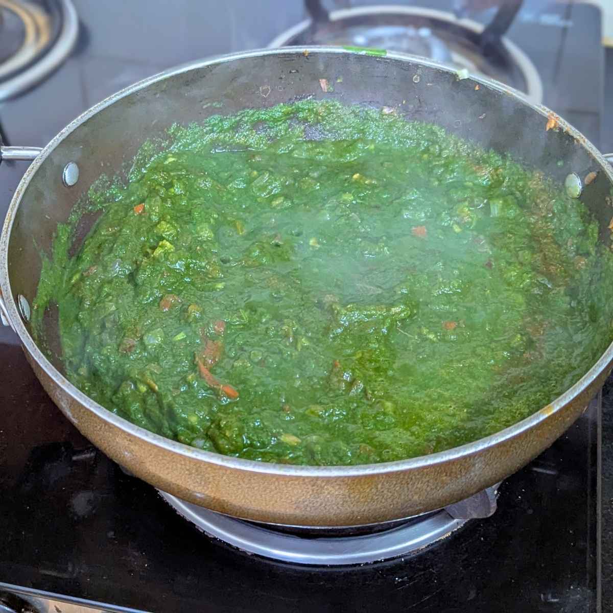 Spinach curry in a pan.