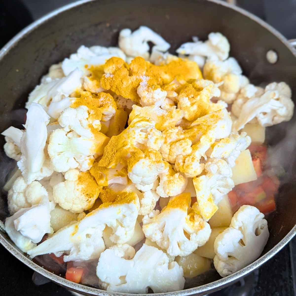 cauliflower and potato with turmeric and salt