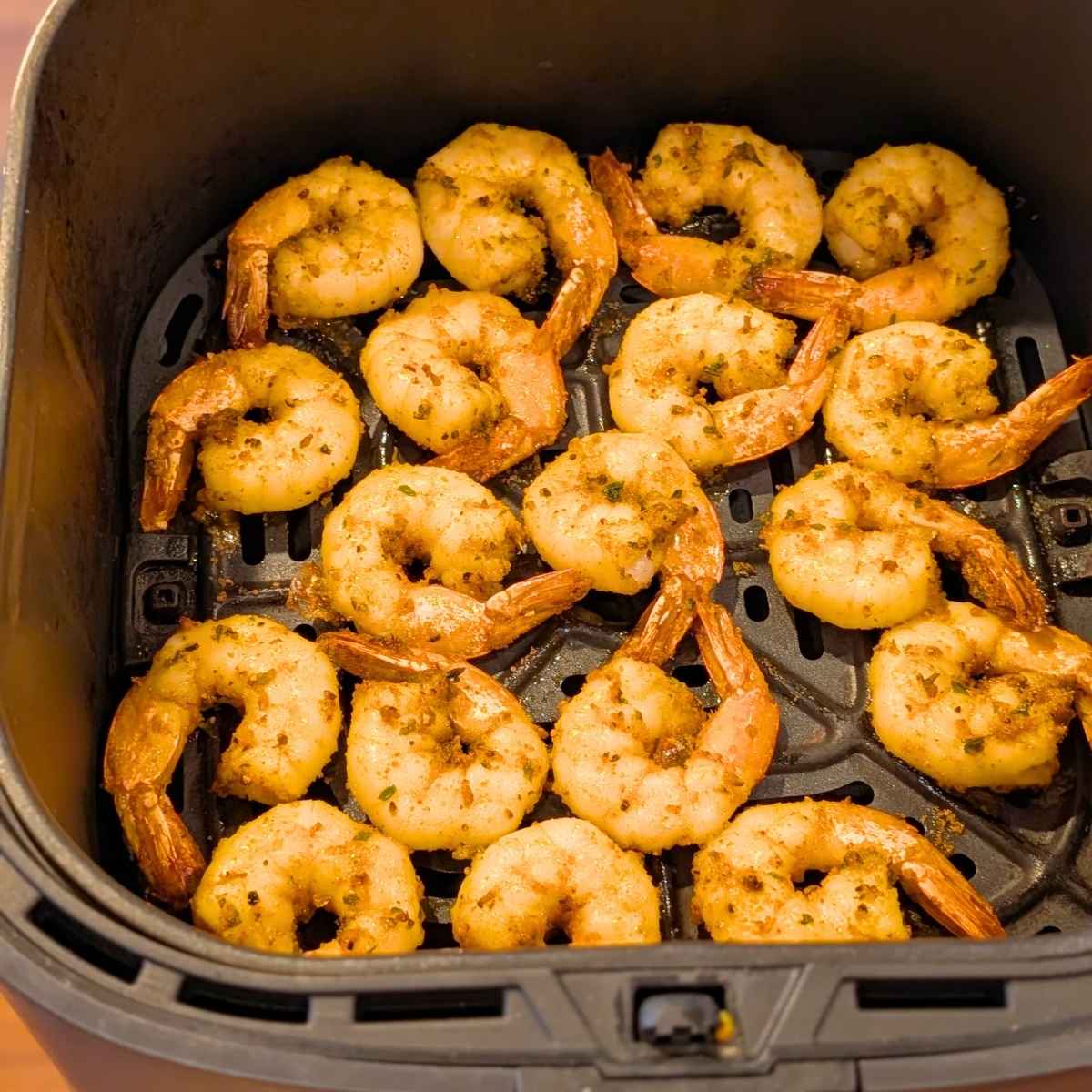 Crispy air fried shrimp in air fryer basket