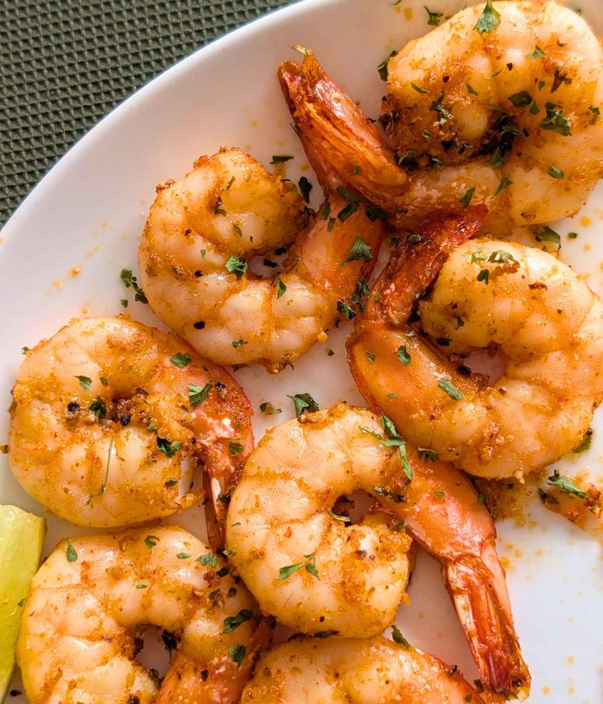 Crispy air fried shrimp served on a white plate.