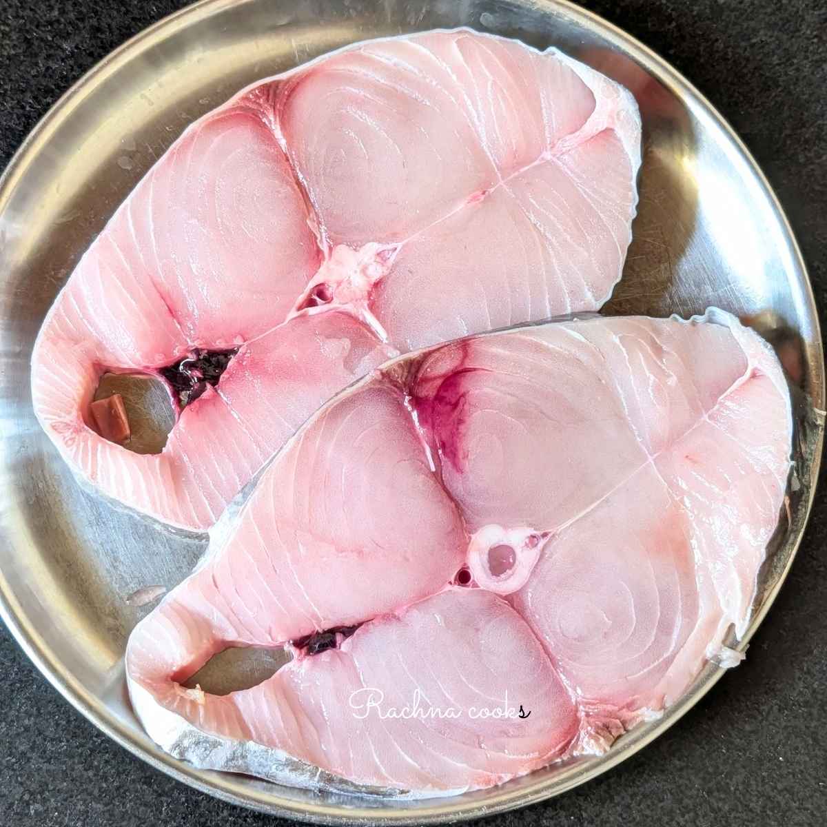 Two large surmai fillets in a plate