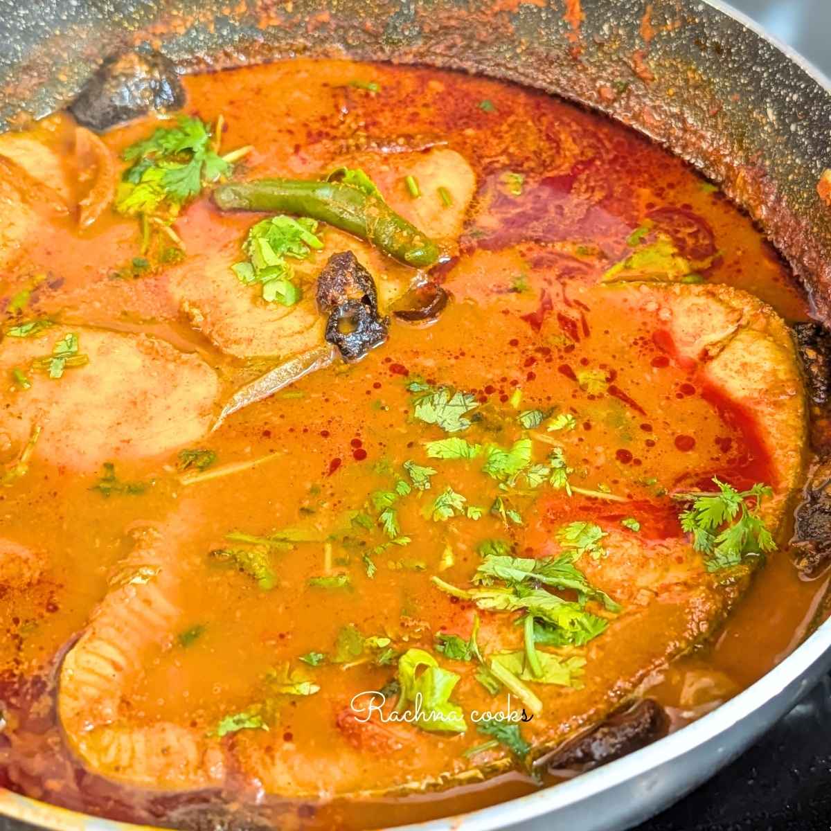 Malvani curry with surmai fillets garnished with chopped cilantro