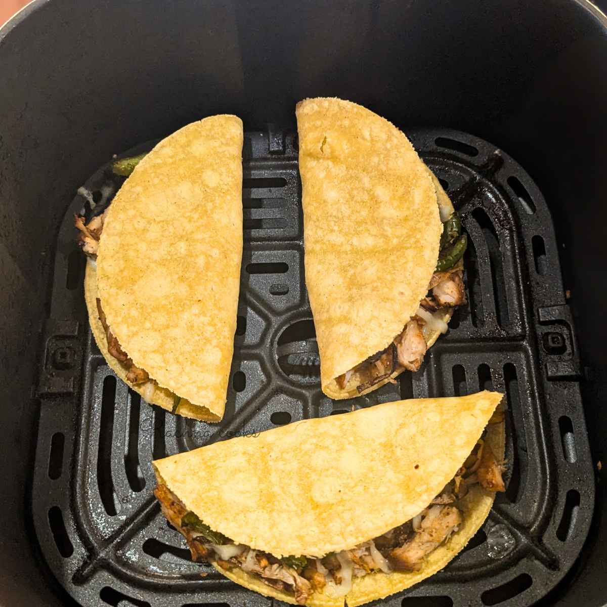 3 Chicken tacos in air fryer basket