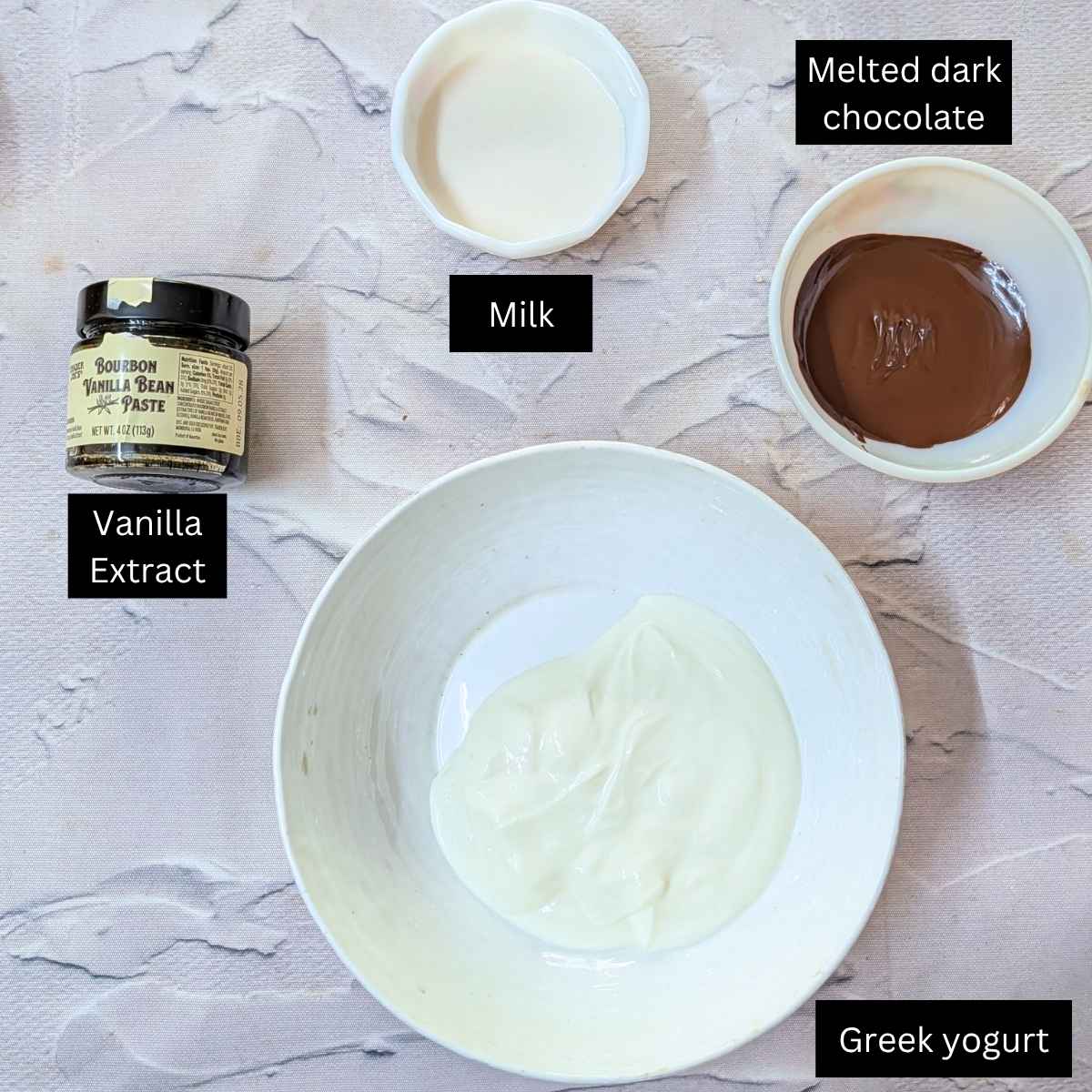 Ingredeitns for making yogurt chocolate popsicles.