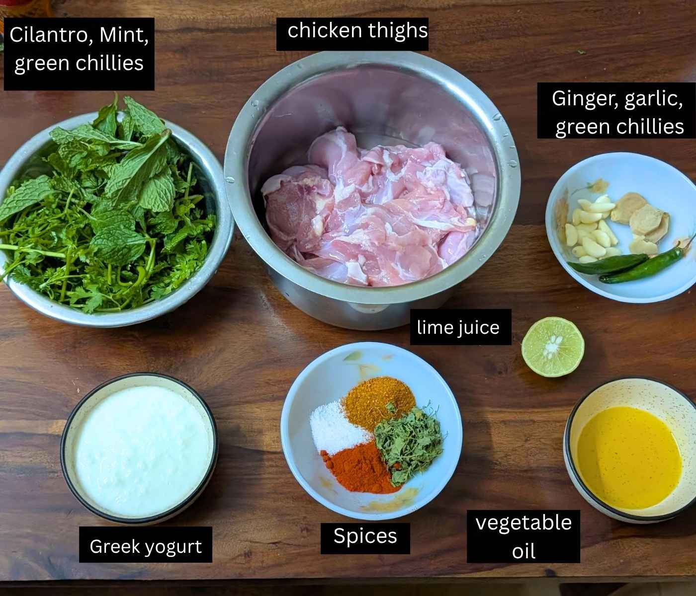 Ingredients to make hariyali chicken tikka on a board