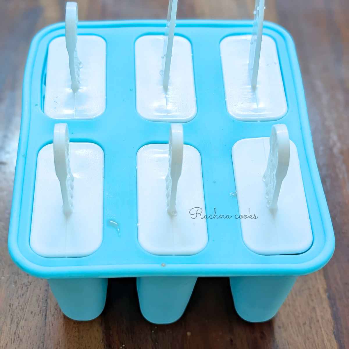 Watermelon mixture in popsicle molds