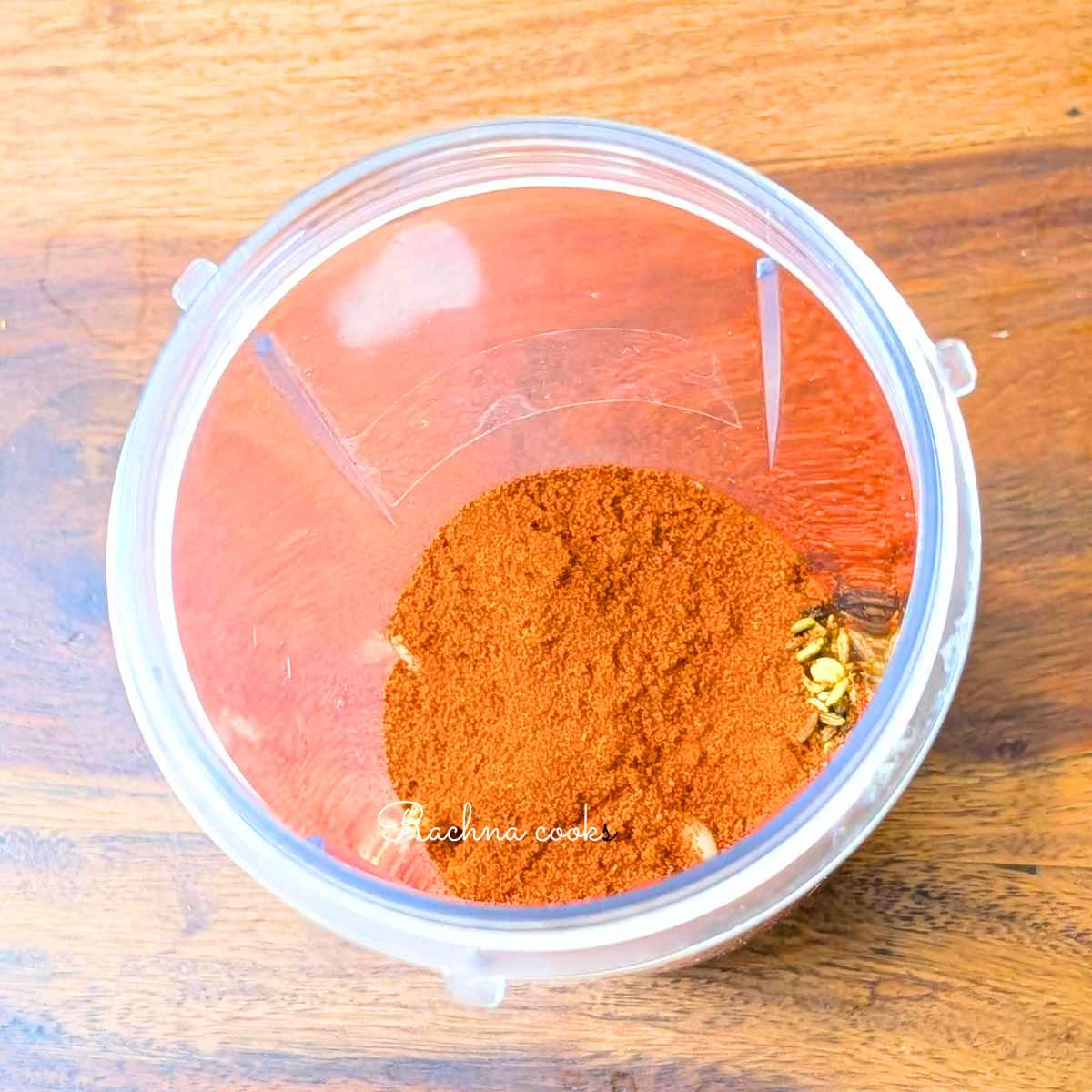 Dry spices with red chilli powder in a blender jar