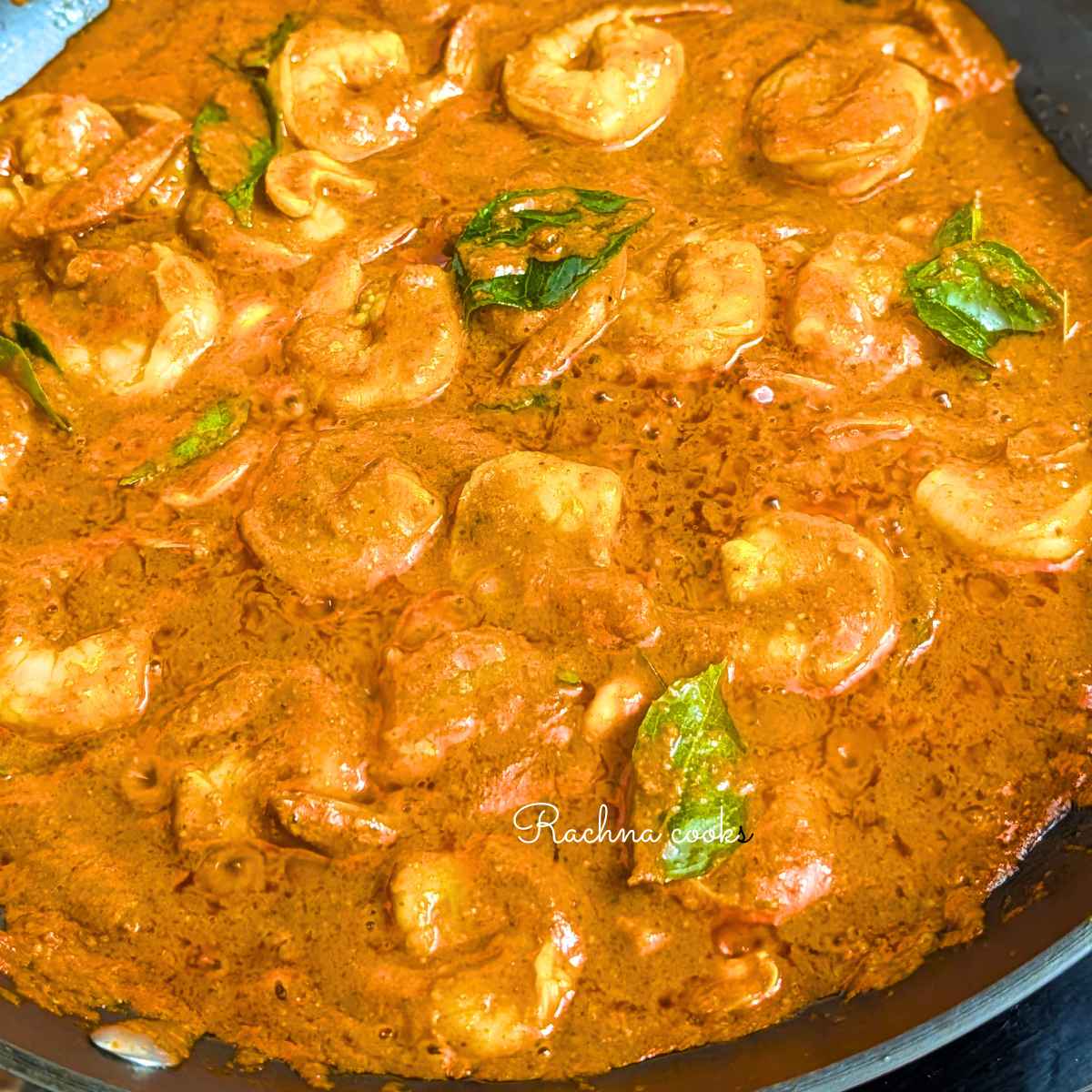 Delicious ghee roast prawns in a large pan