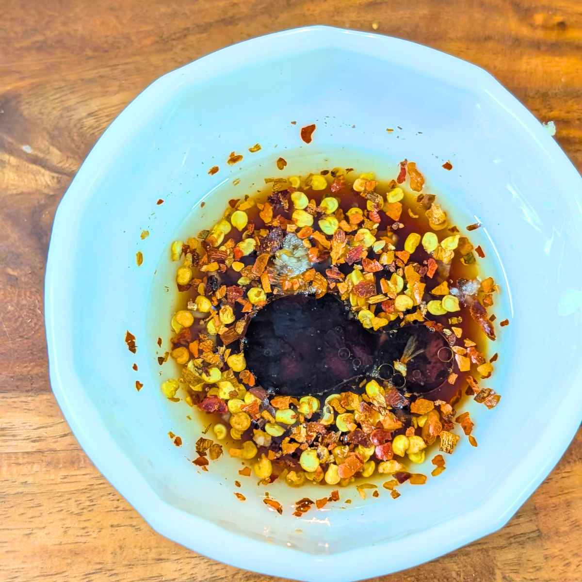 Dressing made with balsamic vinegar, cherry flakes etc.