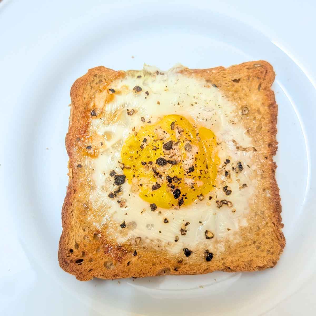 Egg toast after air frying served on a white plate