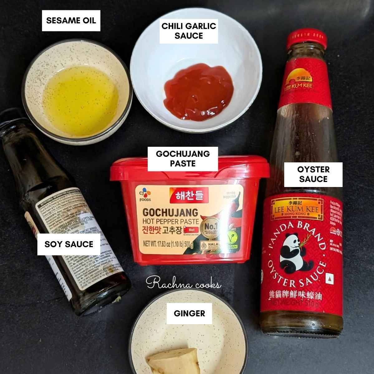 Ingredients to make gochujang chicken on a black background