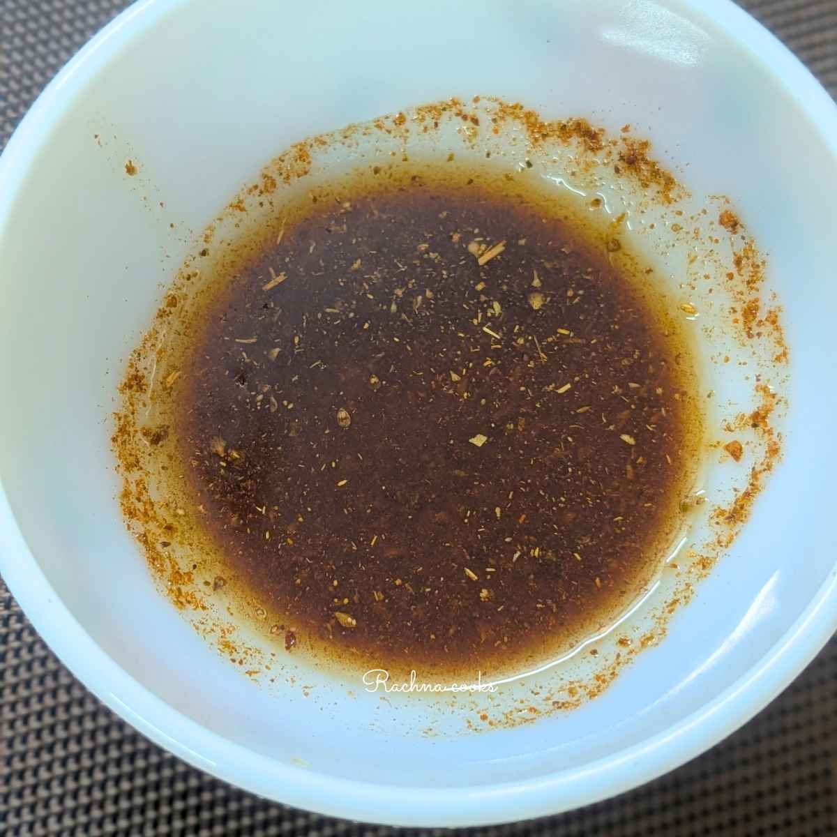 Olive oil with seasonings in a bowl